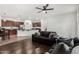 Open-concept living room showcasing seamless flow into the kitchen with modern finishes and ample natural light at 2986 E Country Shadows St, Gilbert, AZ 85298