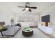 Bright and modern living room, showcasing contemporary furniture and open space with a view to a second living area at 2986 E Country Shadows St, Gilbert, AZ 85298