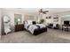 Spacious main bedroom featuring ample natural light, plush carpeting, and a cozy seating area at 2986 E Country Shadows St, Gilbert, AZ 85298