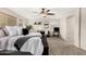 Bright, spacious main bedroom with plush carpet, king-sized bed, seating area, and lots of natural light at 2986 E Country Shadows St, Gilbert, AZ 85298
