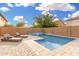 Relaxing private pool with lounge chairs, set in a well-maintained backyard with ample space for entertainment at 2986 E Country Shadows St, Gilbert, AZ 85298