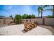 The backyard has adirondack chairs in a tiled section of the yard at 3103 S Benton --, Mesa, AZ 85212