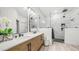 Modern bathroom with double sink vanity, sleek mirrors, and a glass-enclosed shower at 3103 S Benton --, Mesa, AZ 85212