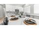 Modern kitchen with a marble island, white cabinets, sleek appliances, and stylish decor, ready for cooking at 3103 S Benton --, Mesa, AZ 85212