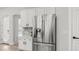 Bright kitchen features white cabinetry, stainless appliances, marble counters, and an exterior door at 3103 S Benton --, Mesa, AZ 85212