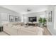 Bright living room features a large sectional, modern fireplace, and stylish decor creating a cozy space at 3103 S Benton --, Mesa, AZ 85212