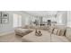 Spacious living room connected to a modern kitchen, featuring a large sectional sofa and stylish design at 3103 S Benton --, Mesa, AZ 85212