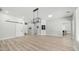 Spacious living room with wood-look flooring and a sliding barn door at 3103 S Benton --, Mesa, AZ 85212