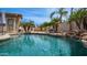 Backyard pool view featuring a soothing waterfall, palm trees, and a relaxing space for entertaining and enjoyment at 3103 S Benton --, Mesa, AZ 85212