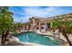 Inviting backyard pool and lounge area perfect for outdoor relaxation and fun, surrounded by lush palm trees at 3103 S Benton --, Mesa, AZ 85212