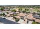 Bird's eye view of a desert home in a residential area with a park, featuring a tile roof and mature trees at 3441 S Halsted Pl, Chandler, AZ 85286