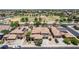 This home features a well-manicured yard, desert landscaping, a tile roof, and a two-car garage at 3441 S Halsted Pl, Chandler, AZ 85286