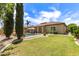 A lush backyard features a sparkling pool and a well-manicured lawn for outdoor enjoyment at 3441 S Halsted Pl, Chandler, AZ 85286