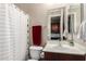 Cozy bathroom with neutral tones, including a shower, sink, mirror, and dark wood vanity at 3441 S Halsted Pl, Chandler, AZ 85286