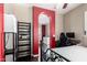 Inviting bedroom with dark wood floors, red accents, and an archway to the rest of the house at 3441 S Halsted Pl, Chandler, AZ 85286