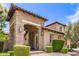 Inviting stone-accented home with covered entryway, manicured landscaping, and a warm, welcoming ambiance at 3441 S Halsted Pl, Chandler, AZ 85286