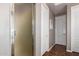 Hallway featuring a shower, and multiple doors leading to various rooms in the home at 3441 S Halsted Pl, Chandler, AZ 85286