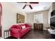 Cozy living room with a comfortable sofa, hardwood floors, and plantation shutters at 3441 S Halsted Pl, Chandler, AZ 85286