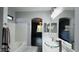 Modern bathroom features a glass vessel sink, tub, and decorative lighting at 3555 E Feather Ave, Gilbert, AZ 85234