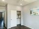 Bedroom featuring hardwood floors, a closet, and neutral paint at 3555 E Feather Ave, Gilbert, AZ 85234