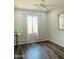 Bedroom showcasing hardwood floors, neutral paint, natural light, and minimalist decor at 3555 E Feather Ave, Gilbert, AZ 85234