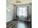 Inviting bedroom with hardwood floors, natural light, and neutral decor at 3555 E Feather Ave, Gilbert, AZ 85234