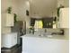 Open kitchen featuring white cabinets, modern appliances and views to living area at 3555 E Feather Ave, Gilbert, AZ 85234