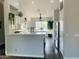Bright kitchen featuring white cabinets, quartz countertops, modern appliances and wood flooring at 3555 E Feather Ave, Gilbert, AZ 85234