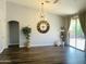 Bright living room with hardwood floors, vaulted ceilings, decorative lighting, and large window at 3555 E Feather Ave, Gilbert, AZ 85234