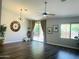 Spacious living room with wood floors, large window, and vaulted ceilings at 3555 E Feather Ave, Gilbert, AZ 85234