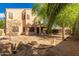 Backyard with desert landscaping and a covered patio at 3750 S Ashley Pl, Chandler, AZ 85286