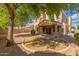 Large backyard featuring desert landscaping and a covered patio area at 3750 S Ashley Pl, Chandler, AZ 85286