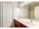Bathroom featuring a double sink vanity with a large mirror at 3750 S Ashley Pl, Chandler, AZ 85286