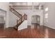 Grand foyer with soaring ceilings, wood floors, and staircase, creating an inviting entrance at 3750 S Ashley Pl, Chandler, AZ 85286
