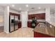 Kitchen with stainless steel refrigerator, granite countertops, and matching appliances at 3750 S Ashley Pl, Chandler, AZ 85286