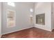 Bright living room featuring large windows, wood floors and neutral walls at 3750 S Ashley Pl, Chandler, AZ 85286