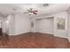 Spacious living room featuring wood floors, a ceiling fan, recessed lighting and large windows at 3750 S Ashley Pl, Chandler, AZ 85286