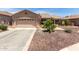 Charming single-story home with a two-car garage, desert landscaping, and a welcoming front entrance at 3930 E Colonial Dr, Chandler, AZ 85249