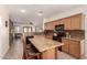 Spacious kitchen with a large island, granite countertops, and stainless steel appliances at 3930 E Colonial Dr, Chandler, AZ 85249