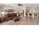 Open-concept living room with a comfortable sofa, stylish decor, and seamless flow into the kitchen area at 3930 E Colonial Dr, Chandler, AZ 85249