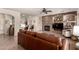 Cozy living room featuring a stone fireplace, comfortable seating and tile floors at 3930 E Colonial Dr, Chandler, AZ 85249