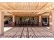 Outdoor patio with pergola and seating area. Overlooks mature landscaping and golf course at 3930 E Colonial Dr, Chandler, AZ 85249