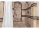 Elegant shower featuring decorative tile and an inset soap nook at 3930 E Colonial Dr, Chandler, AZ 85249