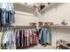 Walk-in closet offering ample storage with multiple shelving and racks at 3930 E Colonial Dr, Chandler, AZ 85249