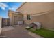 Fully fenced backyard features dog kennel, storage and desert landscaping at 3960 W Salter Dr, Glendale, AZ 85308