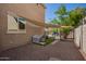 Private backyard with dog kennel, shade, and access to a sparkling pool at 3960 W Salter Dr, Glendale, AZ 85308