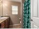 Neutral bathroom featuring a vanity with granite countertops and a shower with a decorative shower curtain at 3960 W Salter Dr, Glendale, AZ 85308