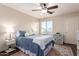 Comfortable bedroom with a ceiling fan, a bright window, and a cozy, inviting bed at 3960 W Salter Dr, Glendale, AZ 85308