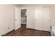 Bedroom featuring a walk-in closet and a view leading to stairs, and a glimpse of the home's interior at 3960 W Salter Dr, Glendale, AZ 85308