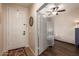 Bright foyer features a tiled floor, white door, and a decorative screen, leading into the open living space at 3960 W Salter Dr, Glendale, AZ 85308